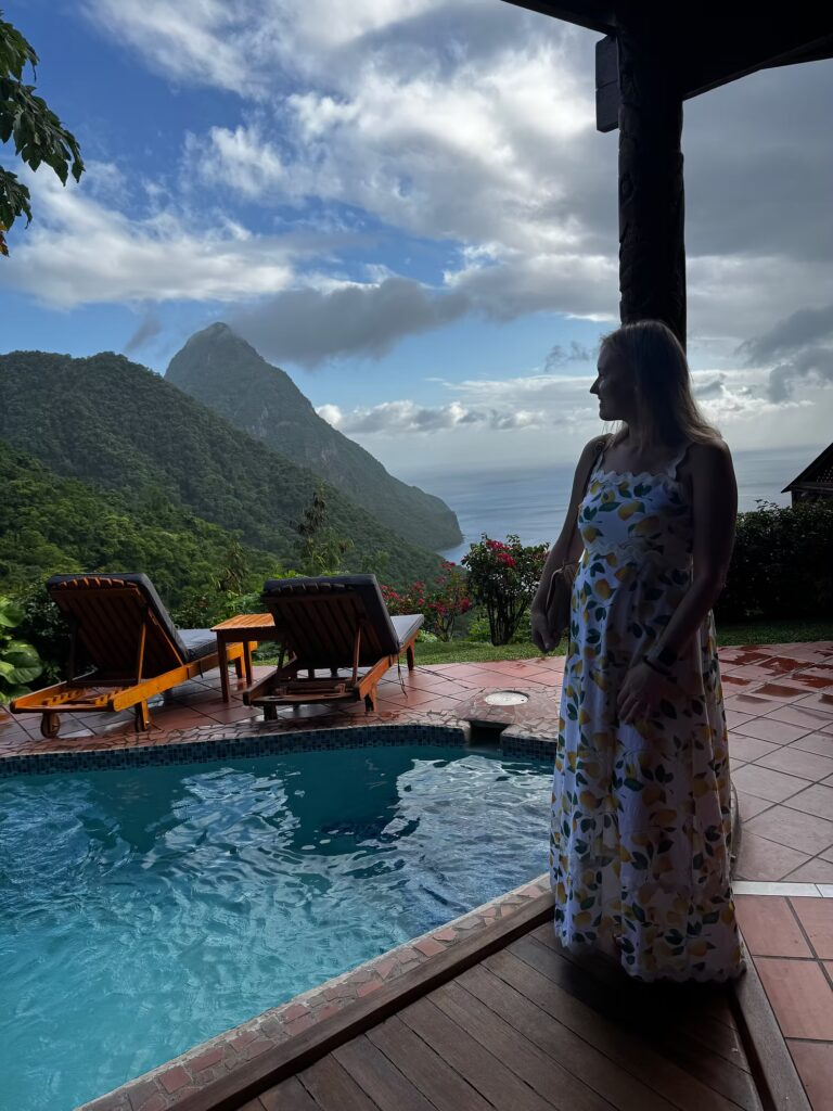 Katie Ellickson standing next to pool at a resort in the Caribbean